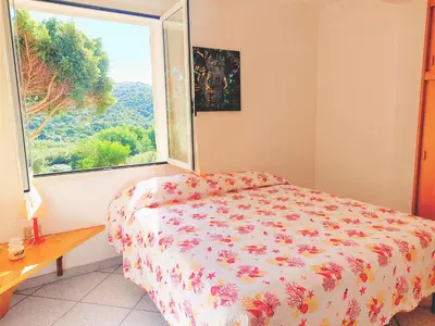 Letto o letti in una camera di Casa Mamà