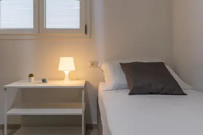 Letto o letti in una camera di Villa Elena - Affitti Brevi Italia