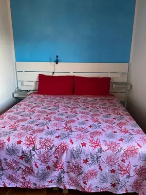 Letto o letti in una camera di Villa del Brigante, 200m from the beach, 80m², 2 bedrooms, 4-5 persons