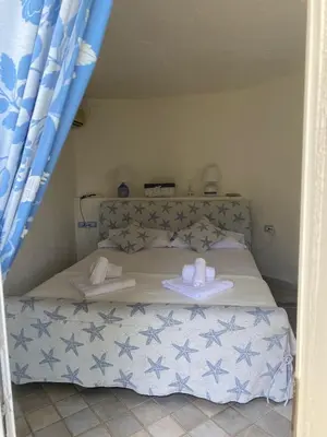 Letto o letti in una camera di Villa Belinda