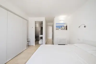 Letto o letti in una camera di Casa Vacanze Zeffiro vista mare con giardino