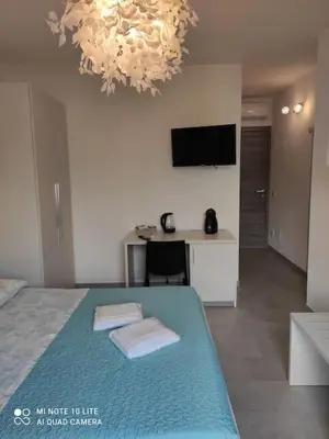 Letto o letti in una camera di SUPER APPARTAMENTO TERRAZZA PANORAMICA 3 CAMERE