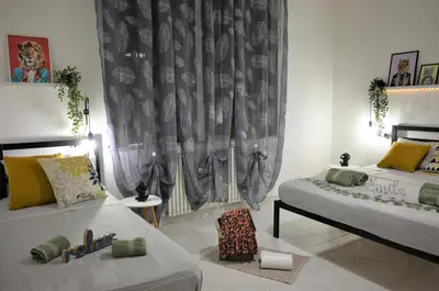 Letto o letti in una camera di Villa Settimia a 50 mt dalla spiaggia!