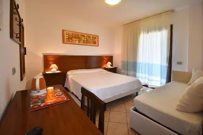 Letto o letti in una camera di Hotel Il Girasole