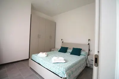 Letto o letti in una camera di Casa Anna Cagliari
