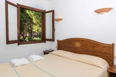 Letto o letti in una camera di Residence Baia delle Palme Studio 43439