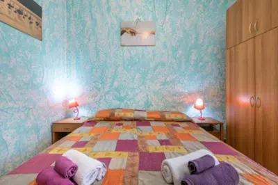 Letto o letti in una camera di Wonderful holiday: relax in the green Villasimius