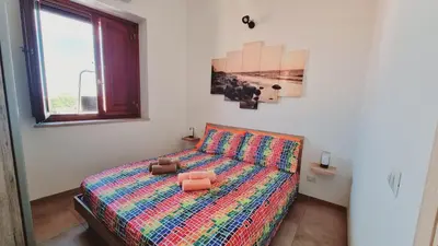 Letto o letti in una camera di Appartamento Tharros