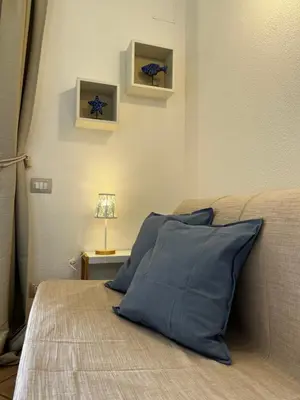 Letto o letti in una camera di Villa Elma