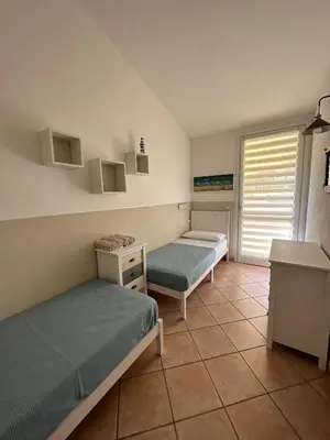 Letto o letti in una camera di Villa Elma