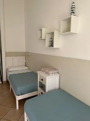 Letto o letti in una camera di Villa Elma