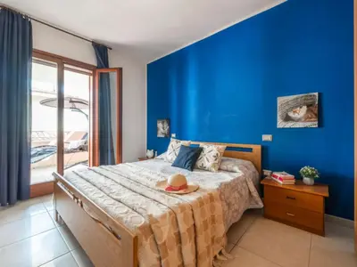 Letto o letti in una camera di L'Oasi della Gatta Panciona
