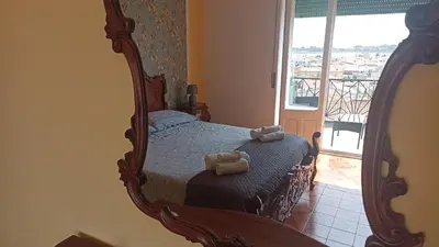 Letto o letti in una camera di L' Appartamento con Vista Carloforte