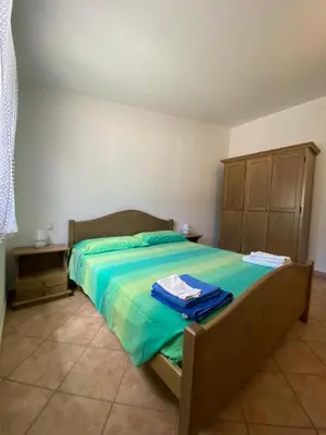 Letto o letti in una camera di Villa Le Palme