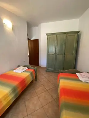 Letto o letti in una camera di Villa Le Palme