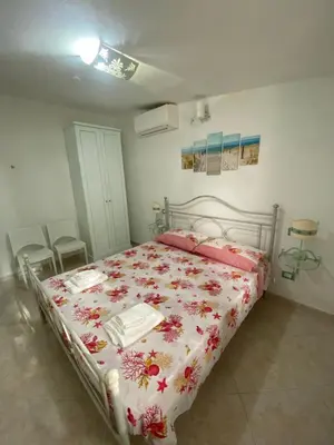 Letto o letti in una camera di Accogliente casa a due passi dal mare.