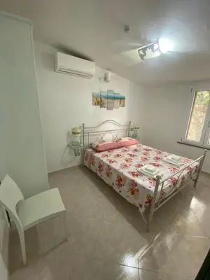 Letto o letti in una camera di Accogliente casa a due passi dal mare.