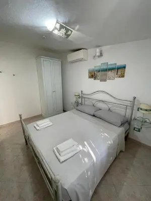 Letto o letti in una camera di Accogliente casa a due passi dal mare.