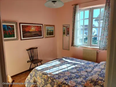 Letto o letti in una camera di Appartamento con vista giardino