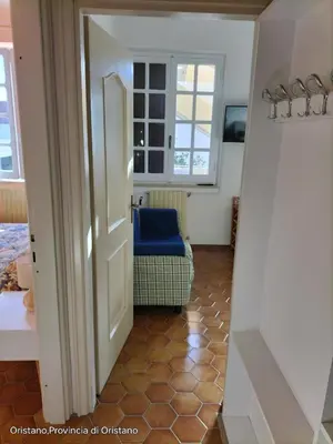 Letto o letti in una camera di Appartamento con vista giardino