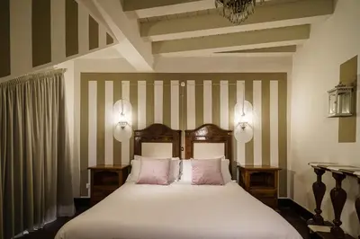 Letto o letti in una camera di Le Meraviglie di Alice