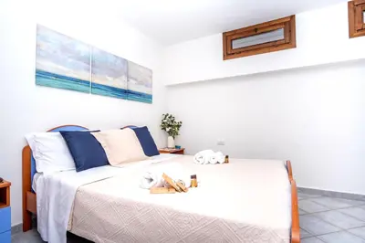 Letto o letti in una camera di Villa sul mare Porto Corallo