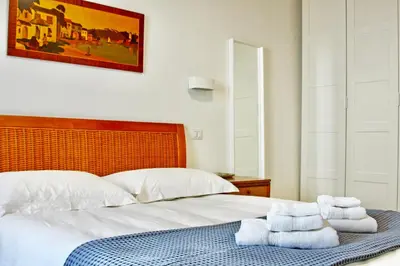 Letto o letti in una camera di Monolocale a pochi passi dal mare