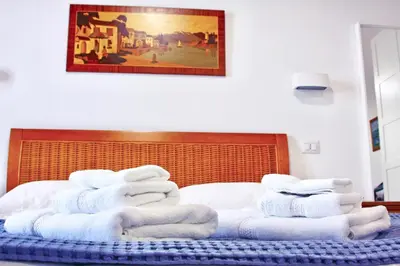 Letto o letti in una camera di Monolocale a pochi passi dal mare