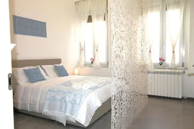 Letto o letti in una camera di Casa Daniela Cagliari