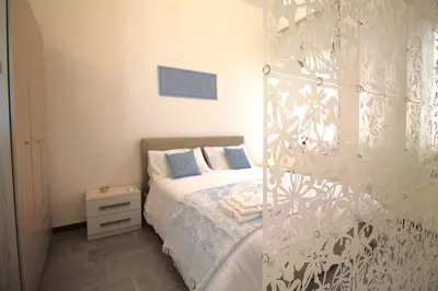 Letto o letti in una camera di Casa Daniela Cagliari