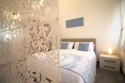 Letto o letti in una camera di Casa Daniela Cagliari