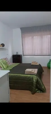 Letto o letti in una camera di Casetta del cuore intero appartamento con camino