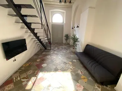 TV o dispositivi per l'intrattenimento presso Casa Flora, a panoramic flat with free car parking