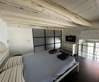 Letto o letti in una camera di Casa Flora, a panoramic flat with free car parking