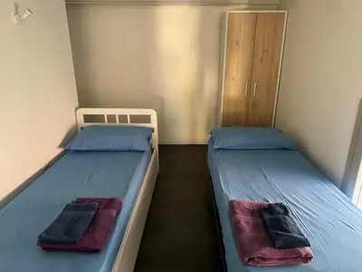 Letto o letti in una camera di Casa Flora, a panoramic flat with free car parking