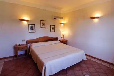 Letto o letti in una camera di Residence Baia delle Palme Apartment 43440