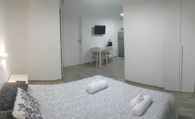 Letto o letti in una camera di Town Center Apartment