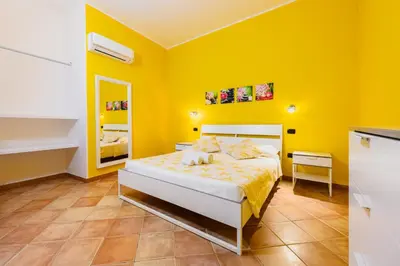 Letto o letti in una camera di Casa Ludovica a 100 passi dal mare