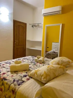 Letto o letti in una camera di Casa Ludovica a 100 passi dal mare
