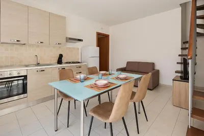 Cucina o angolo cottura di Casa Katia Vacanze Oristano, a pochi minuti dalle spiagge più belle della Sardegna e pochi minuti da Oristano, casa dotata di tutti i comfort