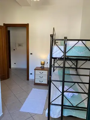 Letto o letti in una camera di appartamento in centro storico con parcheggio coperto, Musci'