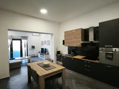 Cucina o angolo cottura di Bidda Mores Appartamenti- Il Cacciatore