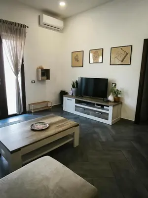 TV o dispositivi per l'intrattenimento presso Bidda Mores Appartamenti- Il Cacciatore