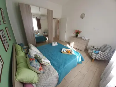 Letto o letti in una camera di Il Melograno casa vacanze