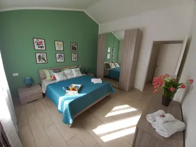 Letto o letti in una camera di Il Melograno casa vacanze