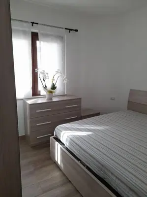 Letto o letti in una camera di Casa al Corso Sant'Antioco (SU)