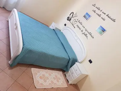 Letto o letti in una camera di Casa vacanza Tommy