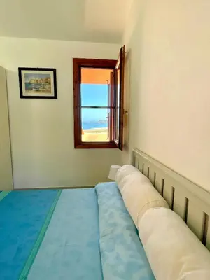 Letto o letti in una camera di -Torre dei Corsari- TERRAZZA SUL MARE