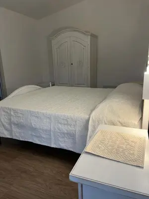 Letto o letti in una camera di B&B Villa Luisella