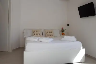 Letto o letti in una camera di Guest House Sciola - TS ROOMS B&B